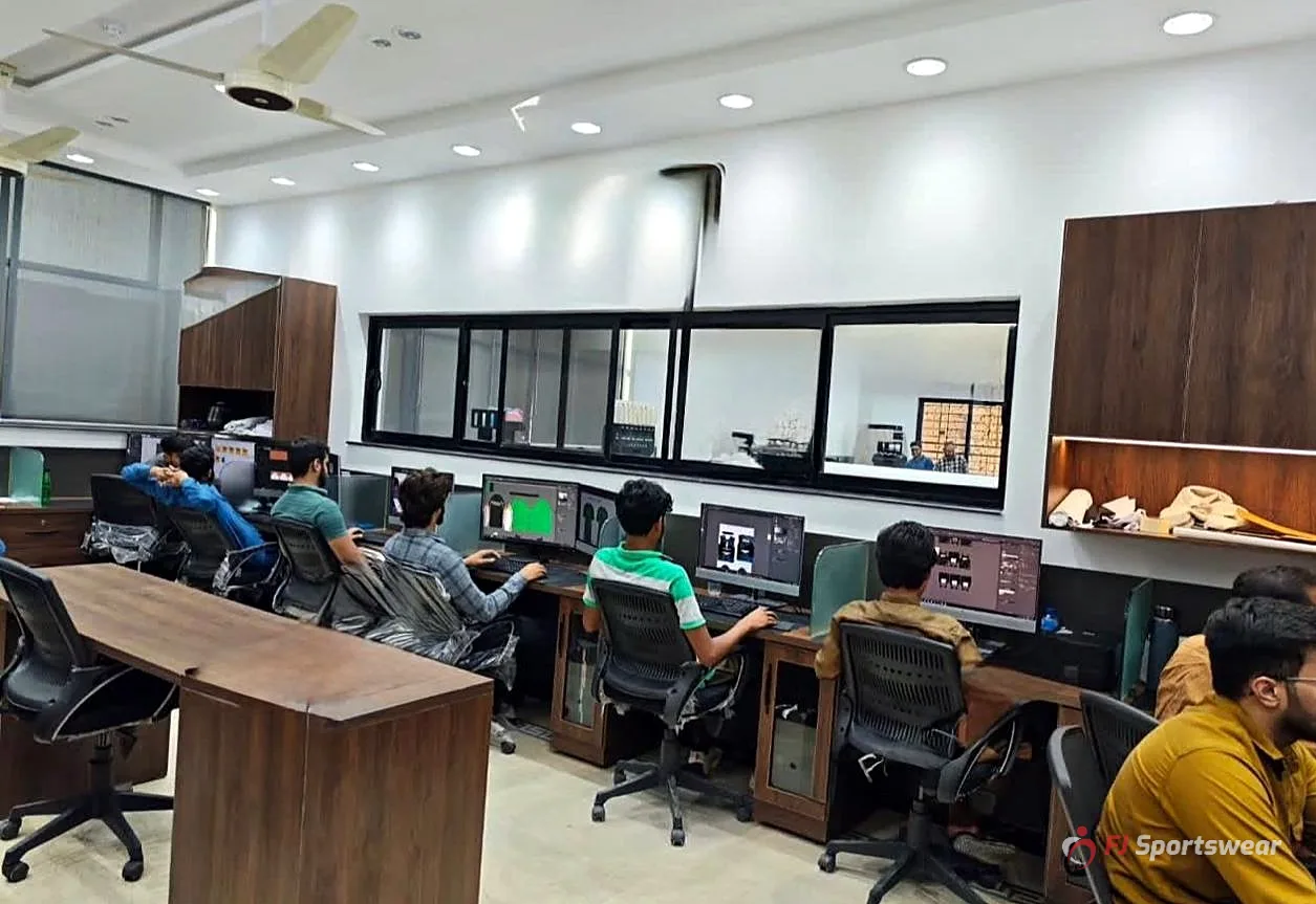 FJ Sportswear design team creating custom uniform mockups on computers
